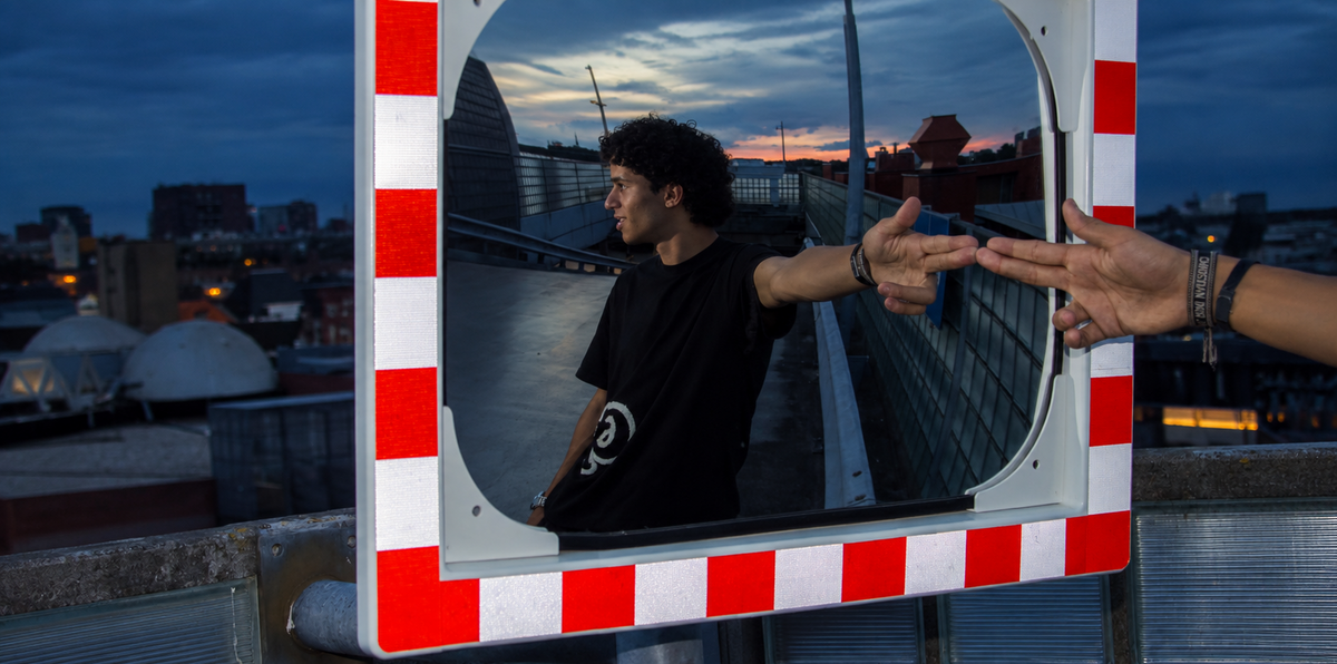 Streetwear rooftop reflection at sunset